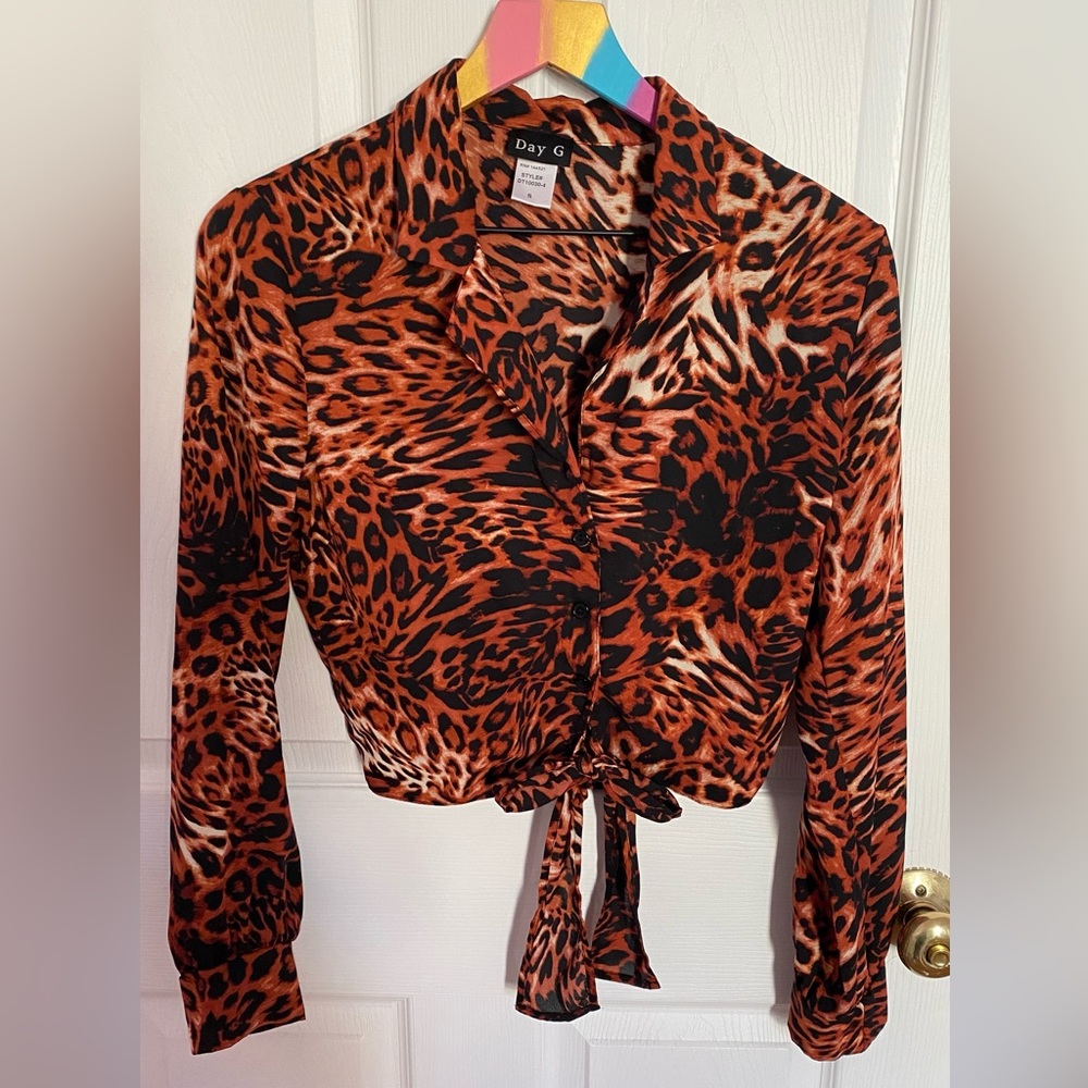 Woman's blouse, S-size with animal Print design, used only once, looks very nice